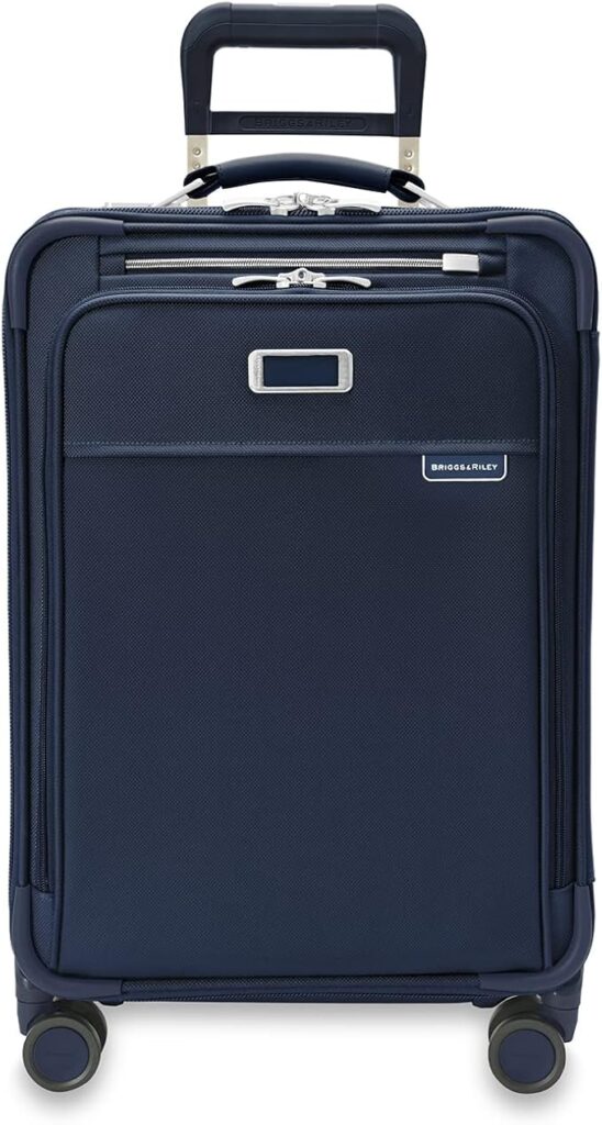 Briggs & Riley Essential Baseline Carry-On suitcase with 360° spinner wheels, expandable design, and efficient organization for smooth travel.