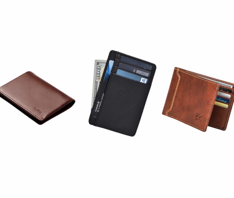 A lineup of stylish everyday carry wallets placed on a wooden desk